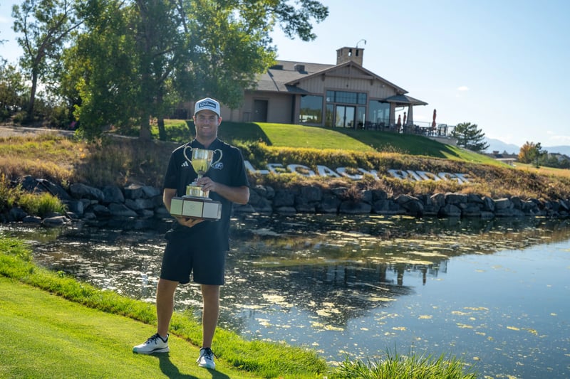 Colin Prater hoists a familiar trophy