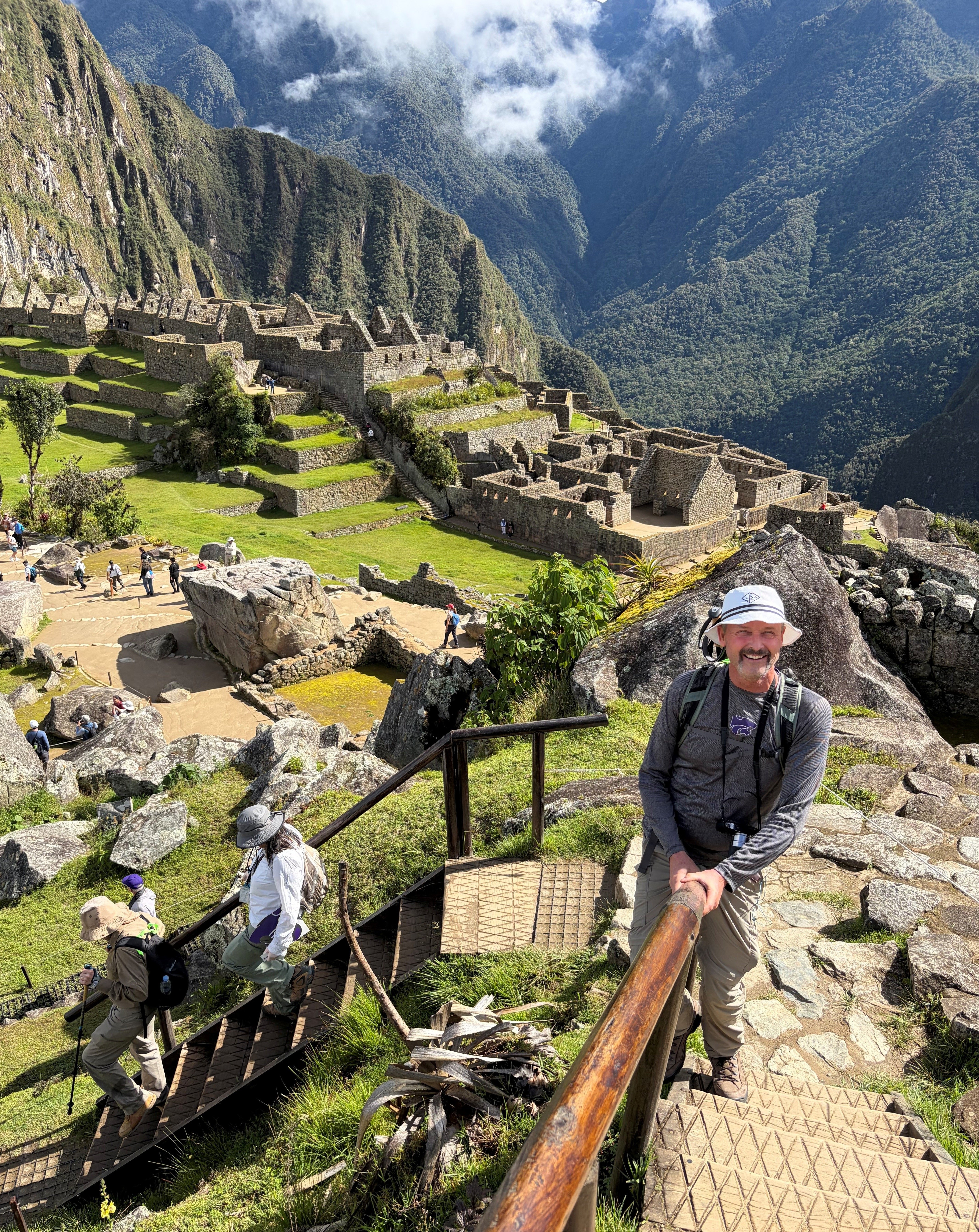 Joe on rail at machu picchu